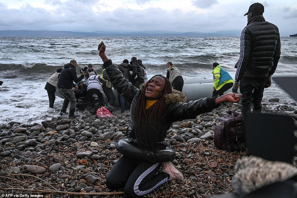25354318-8060403-A_woman_reacts_as_a_dinghy_transporting_27_refugees_and_migrants-a-88_1583011123826