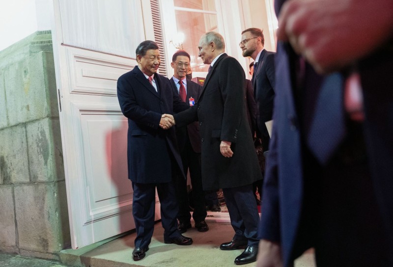 xi-putin-handshake-moscow-GettyImages-1249024900